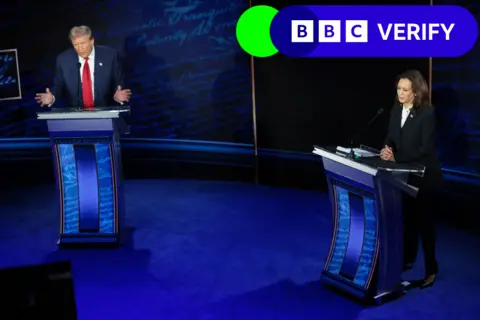 Getty Images Kamala Harris and Donald Trump stand at their podiums during the ABC News presidential debate.