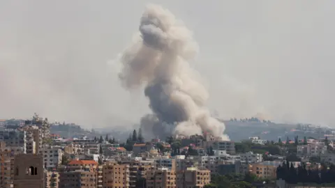 Reuters Smoke billows following an Israeli strike near Tyre, southern Lebanon (23 September 2024)