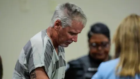 Getty Images Colin Gray, the father of Apalachee High School shooting suspect Colt Gray, at the Barrow County courthouse in Georgia