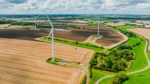 Getty Images Wind turbines on farmland