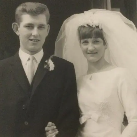 Studio Morgan / Bill and Aileen Turnbull Black and white wedding photo of Bill and Aileen Turnbull in 1967, Bill in smart dark suit and Aileen in white gown