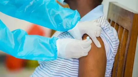 Getty Images A man receiving a vaccine