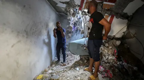 Reuters Abu Nasr destroyed home