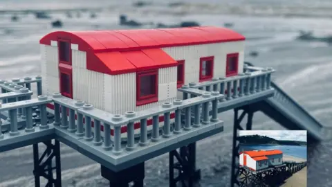 @minibrickarchitecture A Lego model of Tenby lifeboat station, with an inserted picture of the actual lifeboat station in the bottom right-hand corner