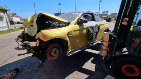 A badly damaged car in Georgia.