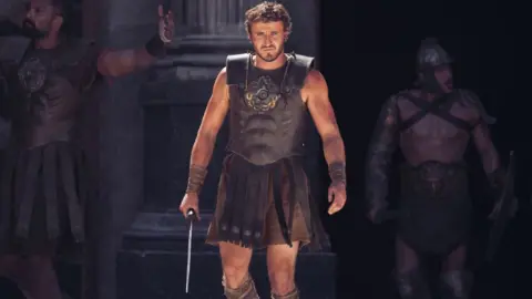 Paramount Paul Mescal in Gladiator II, pictured carrying a sword in the Colosseum