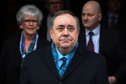 Getty Images Salmond standing outside the High Court in Edinburgh in front of his legal team and supporters.