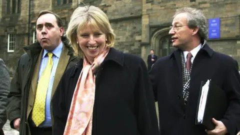 PA Media Scottish Fisheries minister Rhona Brankin arrives to talk to protesting fishermen at the Scottish parliament in Edinburgh with First Minister Henry McLeish (right) and Alex Salmond. * Hundreds of fishermen marched on the Scottish Parliament in a bid to persuade the Executive to compensate them for tying up their boats to conserve fish stocks. A delegation met with Ms Brankin this morning to warn her the fishing industry faces total collapse unless a financial package is brought forward.
