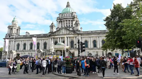 Pacemaker Dozen of young people taking part in a protest outside Belfast City Hall in August against a recent ban on puberty blockers