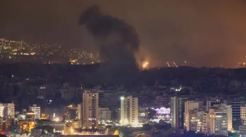 Reuters Smoke billows over Beirut southern suburbs after a strike, amid the ongoing hostilities between Hezbollah and Israeli forces, as seen from Sin El Fil