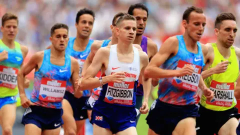 Richard Heathcote/Getty Robbie Fitzgibbon is running in a red, white and blue Great Britain vest, surrounded by other athletes