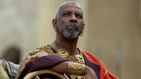 Paramount Denzel Washington in Gladiator II, pictured looking at the sky