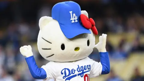 Getty Images Hello Kitty throws out the first pitch before the MLB game between the New York Mets and the Los Angeles Dodgers.