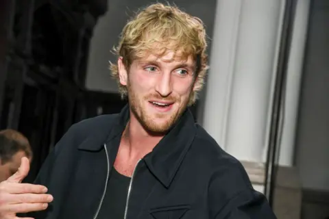 Getty Images A head-and-shoulders shot of Logan Paul, with scruffy blonde hair and a beard.