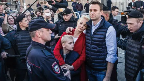 Evgeny Feldman Alexei, Yulia and their son Zakhar at a rally in Moscow in 2017, surrounded by police