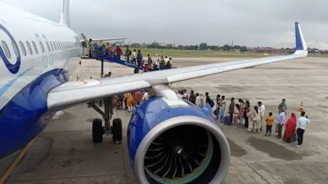 Getty Images Passengers line up and wait for boarding at IndiGo Airlines flight in Jaipur International Airport in Rajasthan State, India, on September 7, 2024.