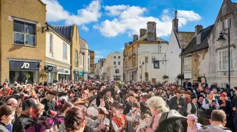 Dave Goulden Hundreds of people dressed as pirates in Weymouth's Millennium Square