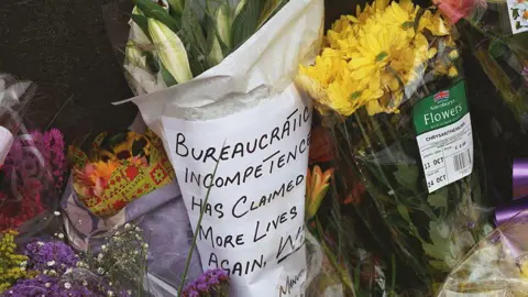 Getty Images Floral tributes were left at the site of the crash