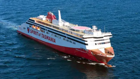 TT-Line A red and white ship with Spirit of Tasmania written on the side. 