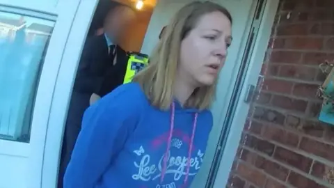 Cheshire Police A screengrab from bodyworn footage of Lucy Letby as she's being arrested 