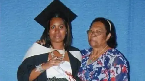 Pascalina Nellan A young woman at a graduation ceremony with her grandmother