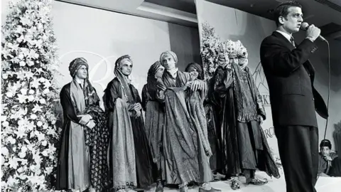 Getty Images Rohit Bal, fashion designer, during a curtain call from New Delhi, India, December 21, 1996. Bal designs for both men and women