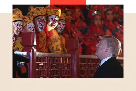 Getty Images US President Donald Trump looks up and talks to opera performers at the Forbidden City in Beijing