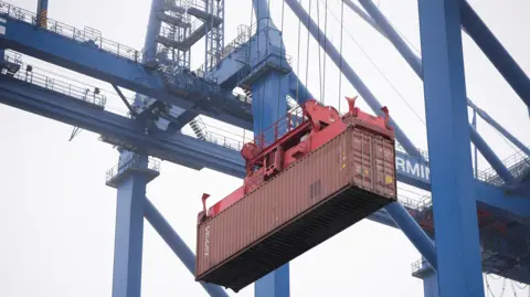 Reuters A crane moves a container at the new megaport being built by China's state-owned Cosco Shipping in Chancay, Peru