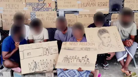 Handout A group of migrants staging a protest on the Indian Ocean island of Diego Garcia