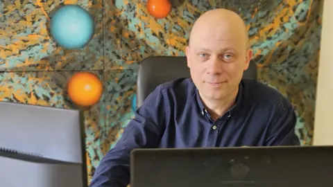 Luc Vocks Dutch entrepreneur Luc Vocks looks at the camera while sat at his desk