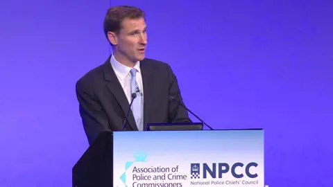 UK Pool Shadow home secretary Chris Philp addresses the National Police Chiefs' Council (NPCC) and Association of Police and Crime Commissioners conference